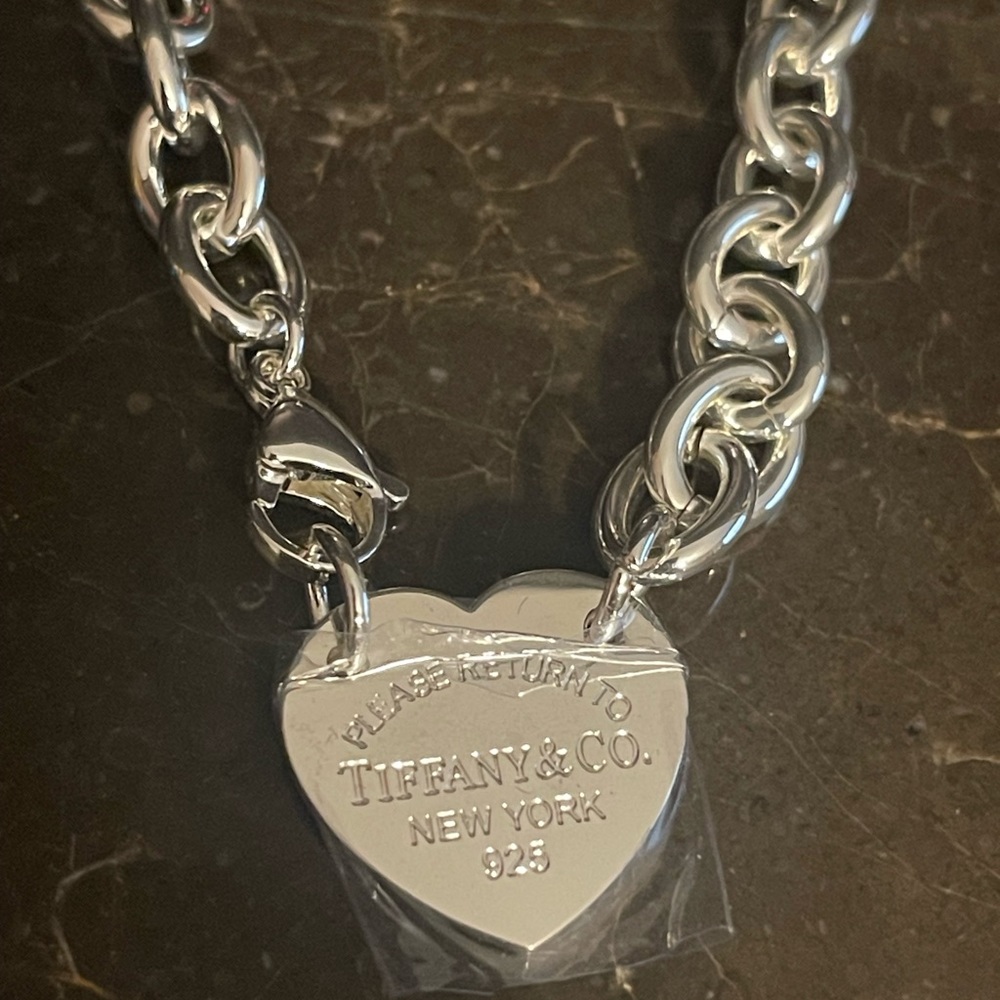 Silver heart necklace. Never worn. Great quality. 24 inches long.